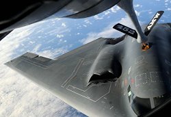 A KC-135 Stratotanker Refuels A B-2 Spirit Over The Pacific Ocean May 12 Near Andersen Air Force Bas